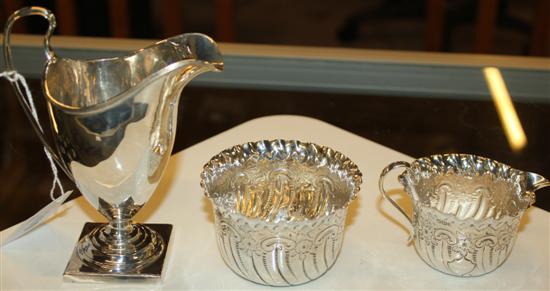 George III silver helmet-shaped pedestal cream jug & later engraved silver cream jug & sugar bowl set